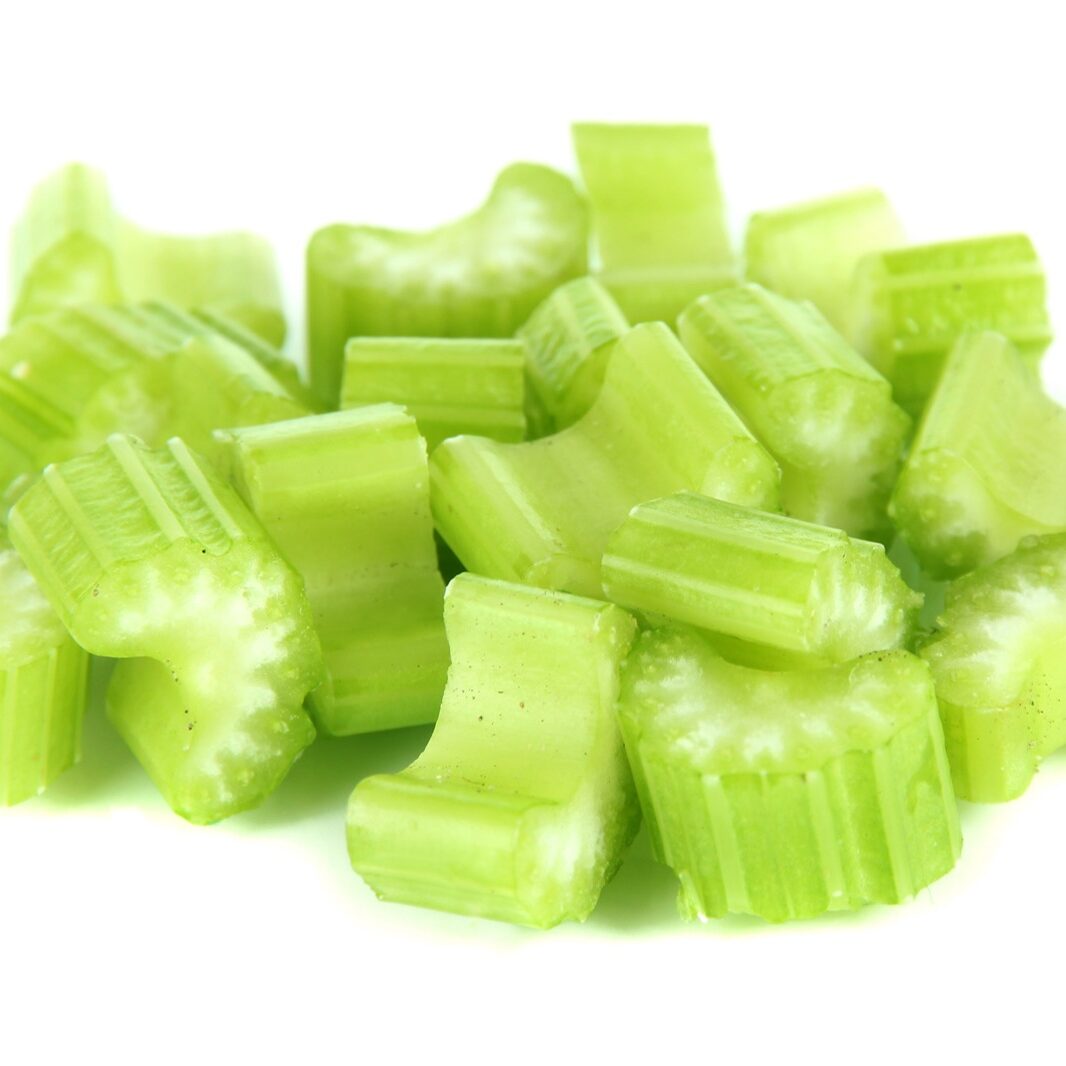 Fresh sliced green celery isolated on white | Hanover Foods